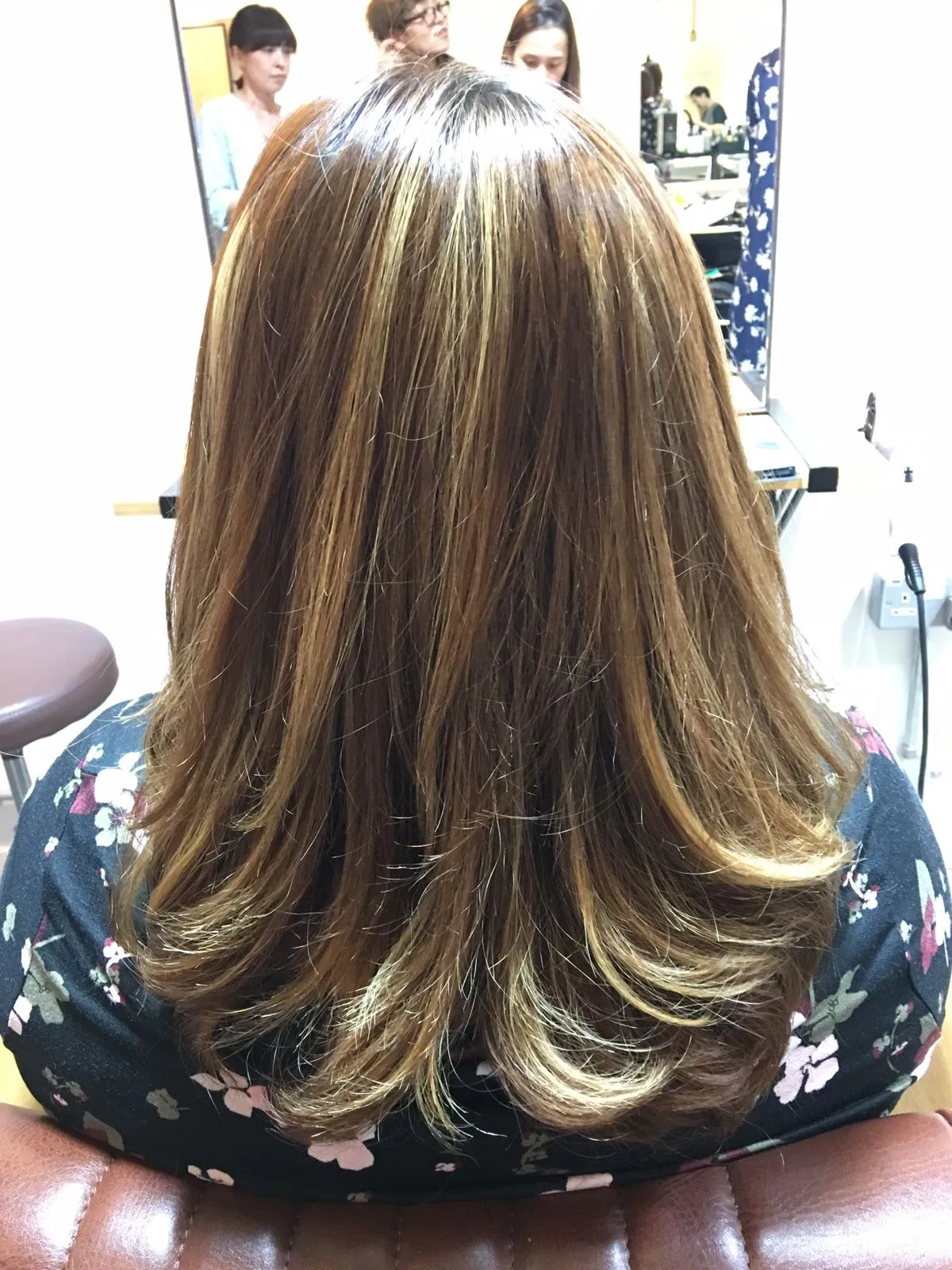 Woman's damaged hair looks visible healthier